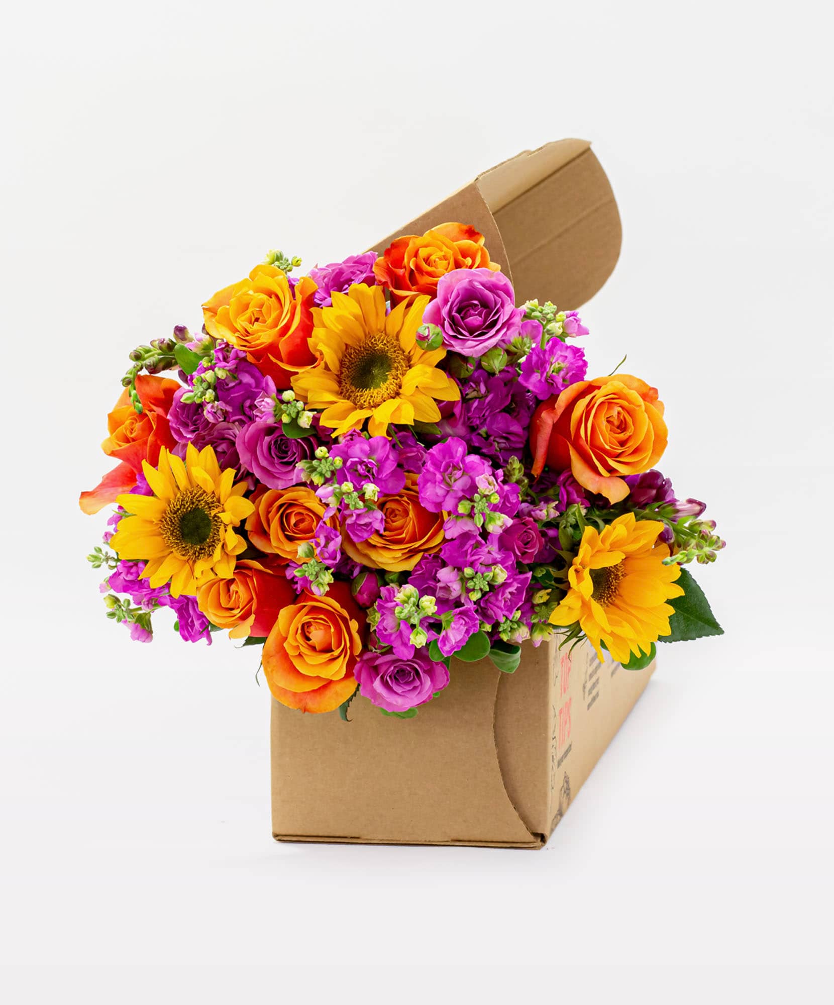 Vibrant floral bouquet featuring sunflowers, roses, and bright blooms in a lovely gift box.