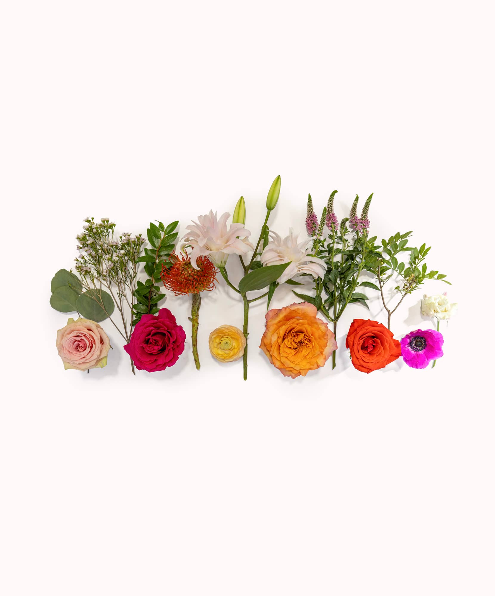 Vibrant flower arrangement featuring roses, lilies, and greenery, perfect for any occasion.